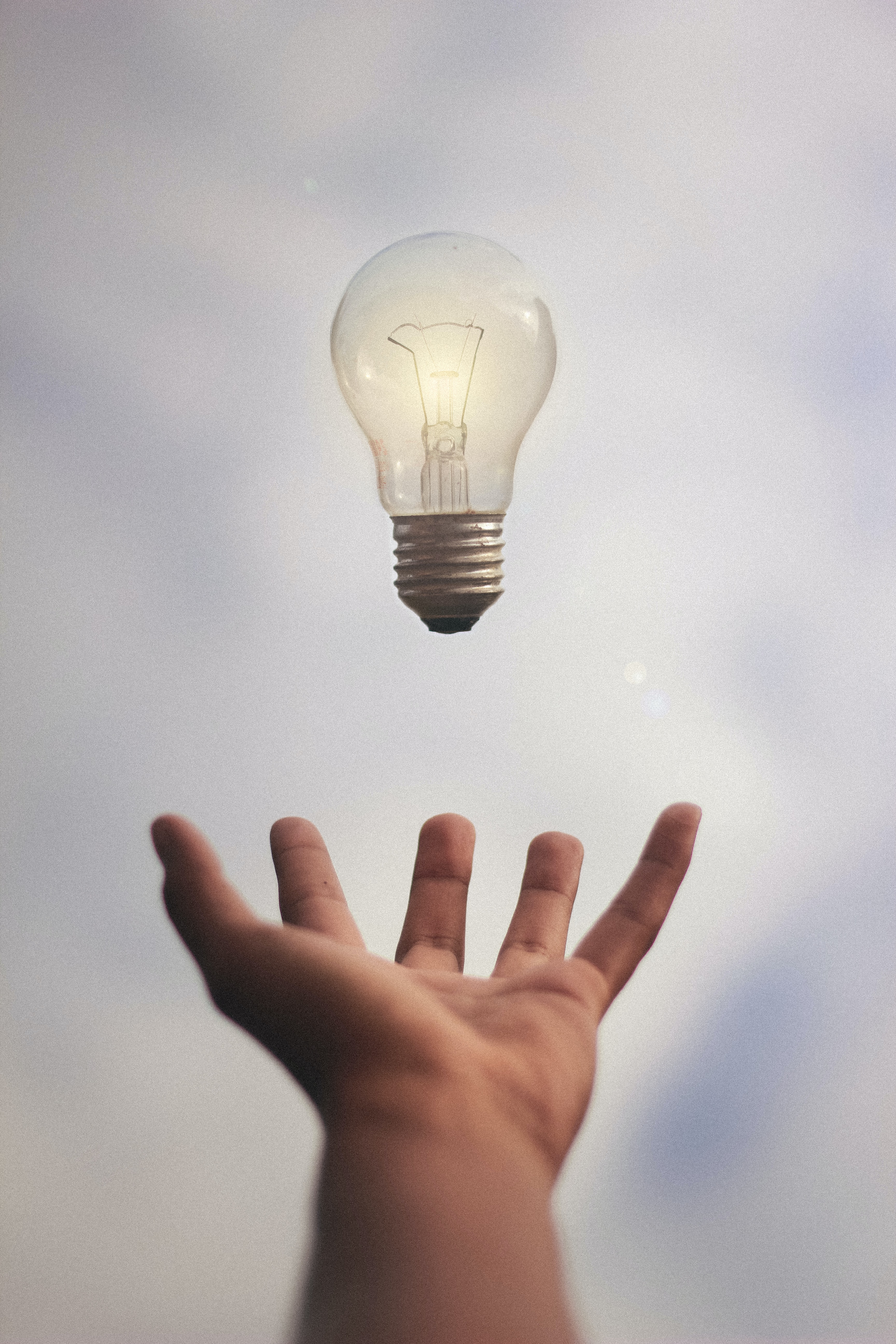 hand with a lighbulb for lead ideas